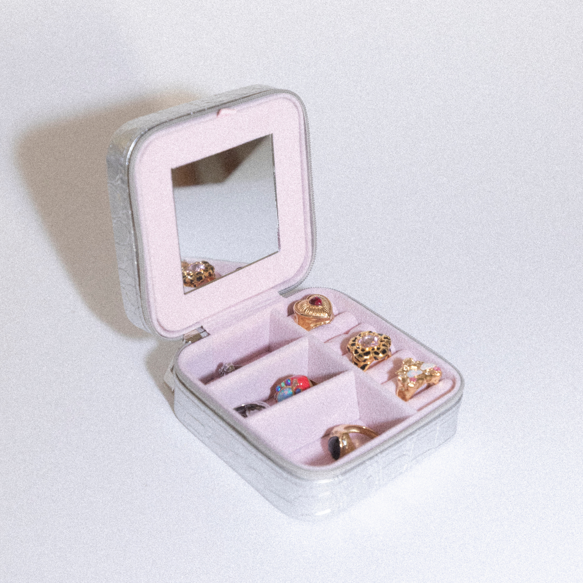 silver july child crocodile patterned travel jewellery case.