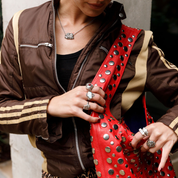 model wearing chunky cherub silver necklace.