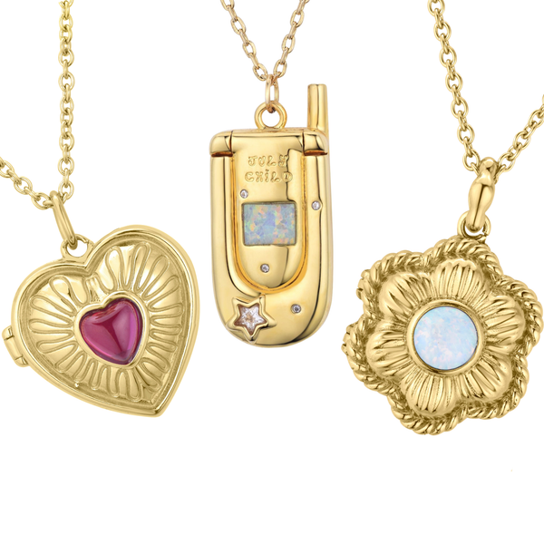 Three gold necklaces with heart, lock, and floral pendants.