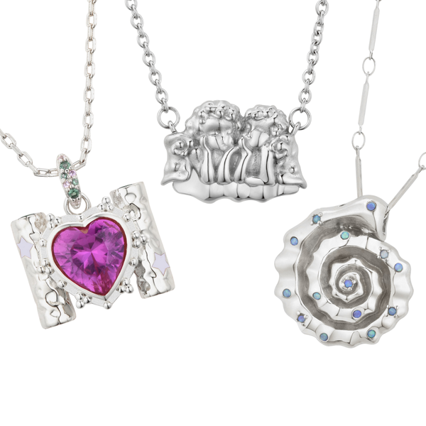 Three silver necklaces with unique pendants.